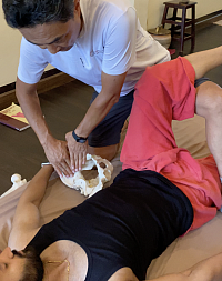 Deep Tissue Massage Course - Working with the iliacus and psoas muscles, emphasizing professional palpation for lower back pain and postural stability